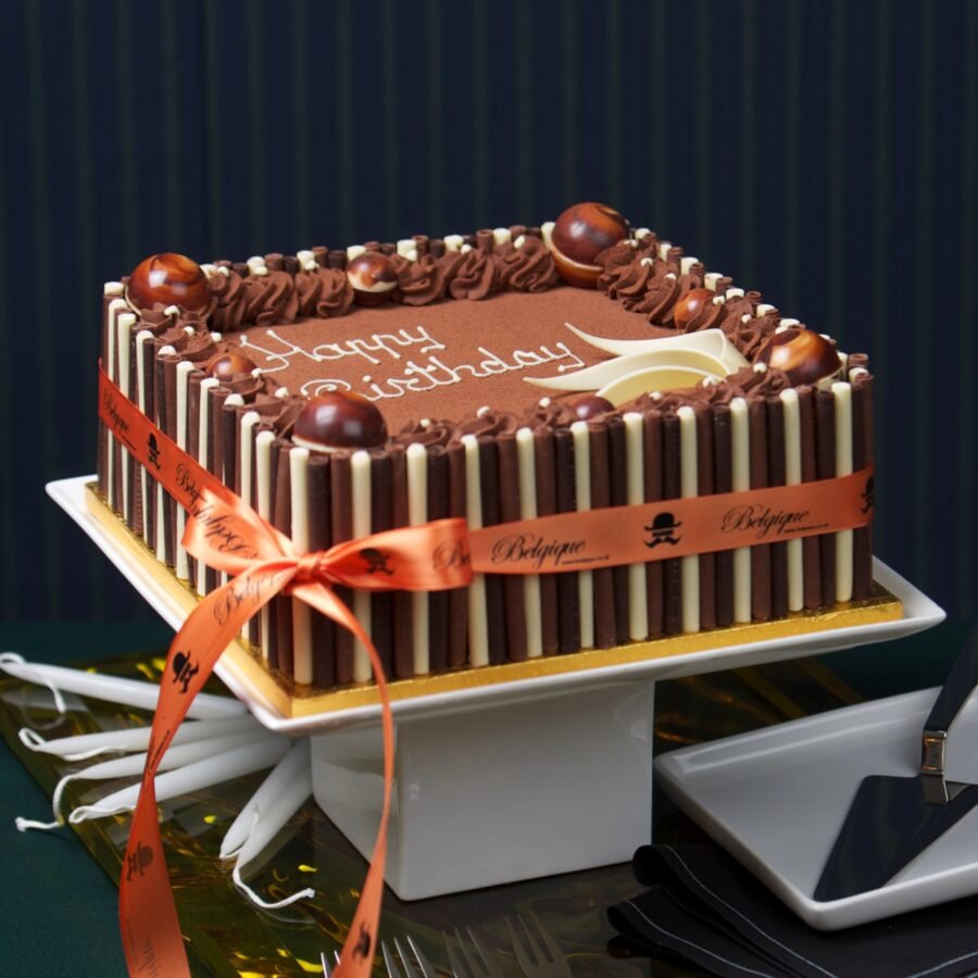 A decadent chocolate gateau cake with rich layers of chocolate sponge and frosting, perfect for celebrations in Upshire