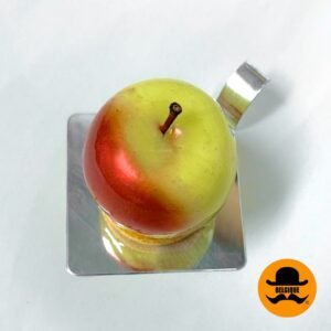 Pomme de Coeur, a luxurious handcrafted dessert by Belgique Hazelnut breton sable, caramel chocolate mousse, caramelised apples, chocolate and apple glaze.